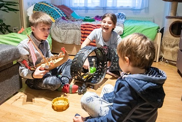 Children playing with toys in a room