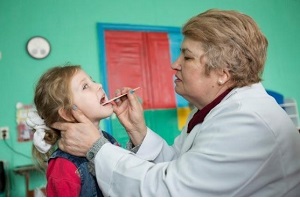 doctor treating a young girl