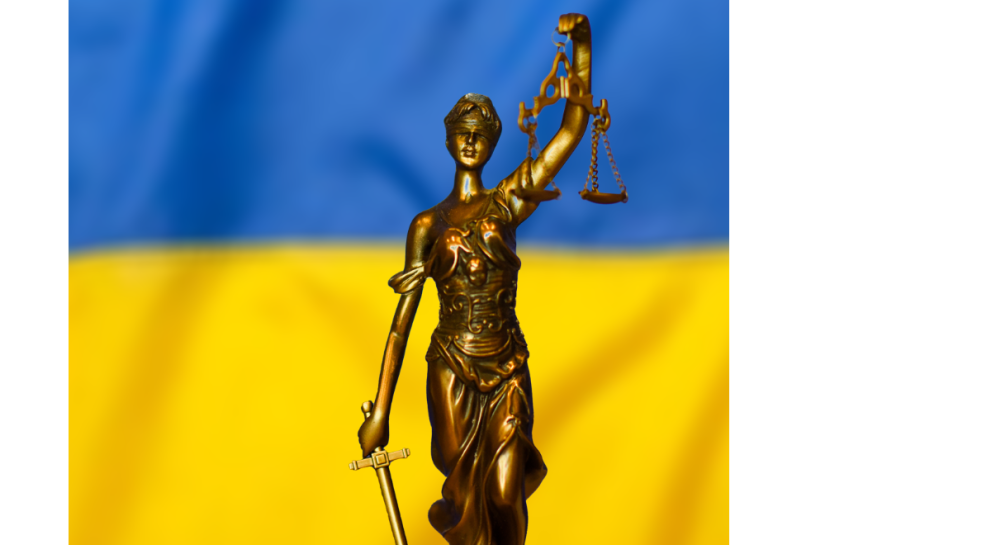 Ukraine flag and justice symbol statue