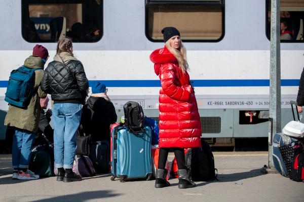 a Ukrainian girl waiting to board a train in Europe