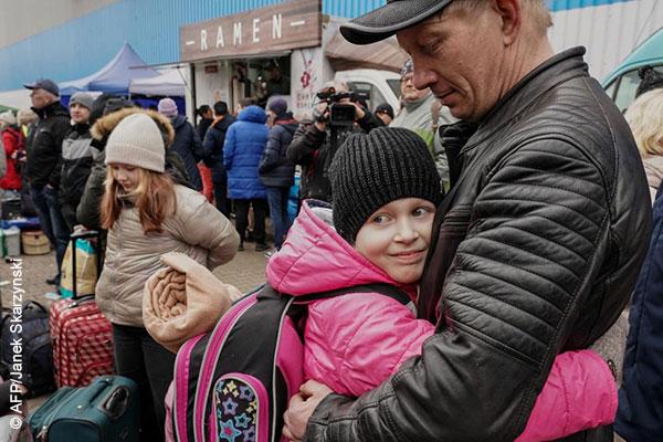 A Ukraine father hugging his daughter 